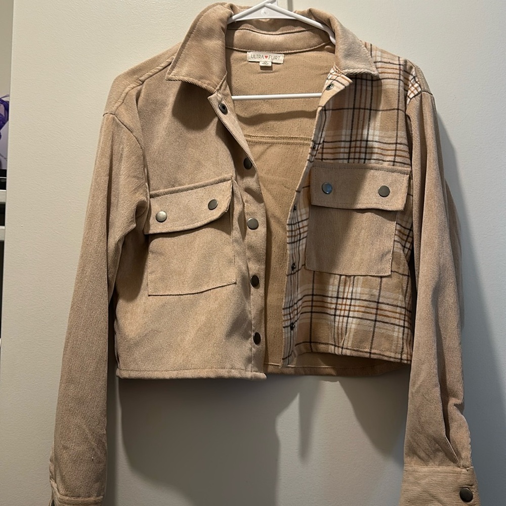 Beige colored cropped button up jacket